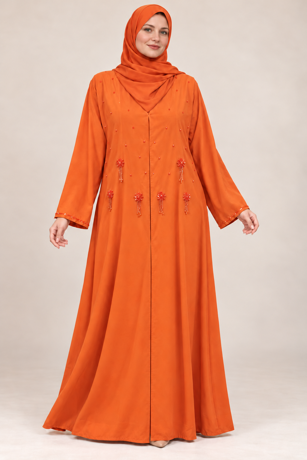 Abaya Soleil — Orange — vue portée de face, broderies et manches visibles