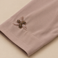 Manche et finition du poignet de l’abaya taupe rosé